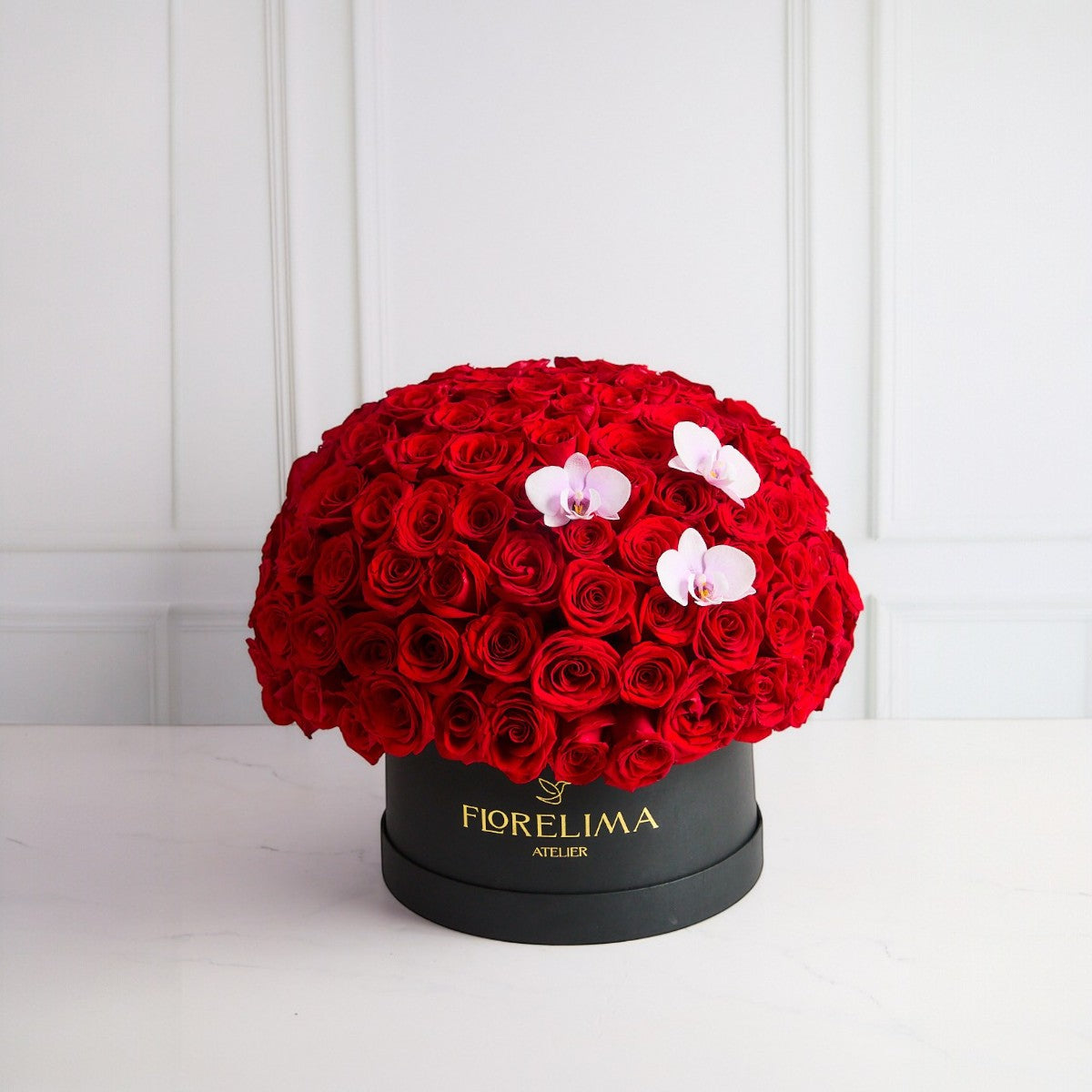 Box Pasión Suprema – 150 Rosas Rojas y 3 Orquídeas